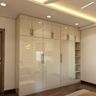 Light-Coloured Glossy Swing Wardrobe - Livspace