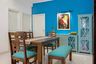 Wooden And Blue 4-Seater Dining Room Design With Blue Seater - Livspace