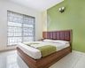Guest Room Design With Green And Beige Dual-Toned Wall - Livspace