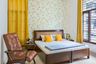 Guest Room Design In Brown And Yellow - Livspace