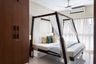 Guest Room Design With Wooden 4-Poster Bed - Livspace