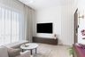 White living room with PoP wall panel and wall mounted TV with storage cabinet - Livspace