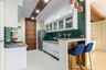 Parallel green and white modular kitchen - Livspace