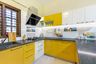 Modular U Shaped Yellow And Frosty White Kitchen Design - Livspace