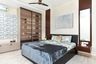Master Bedroom Design With Brown And Glass Wardrobe -  Livspace